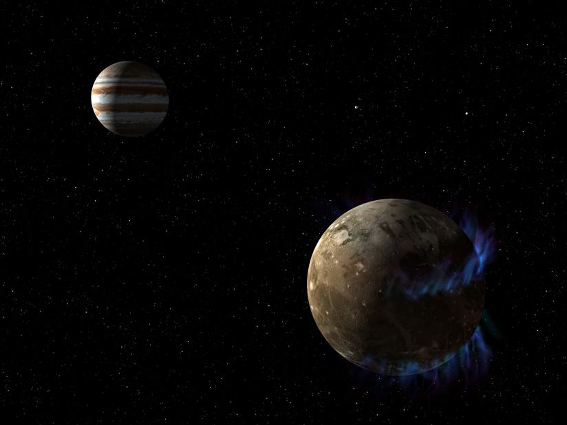 In this artist's concept, the moon Ganymede, right, orbits the giant planet Jupiter. NASA's Hubble Space Telescope observed auroras on the moon generated by Ganymede's magnetic fields. A saline ocean under the moon's icy crust best explains shifting in the auroral belts measured by Hubble.