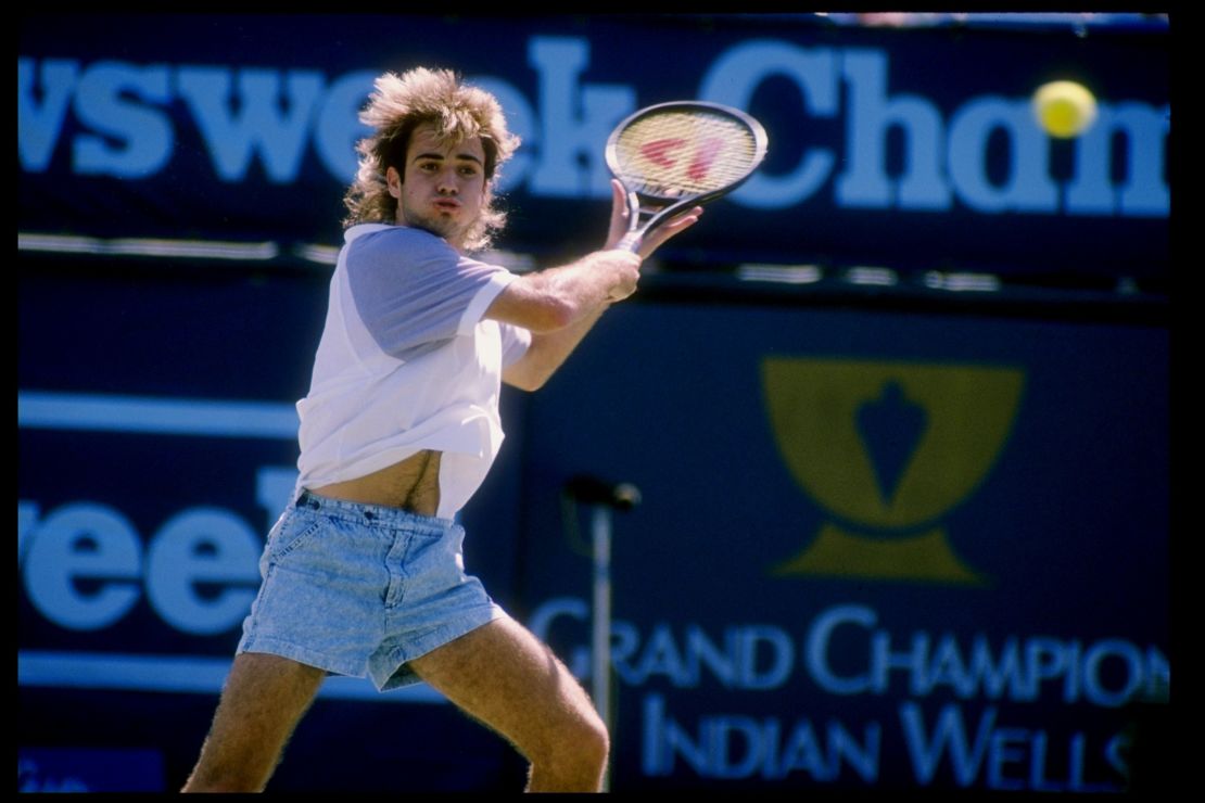Andre Agassi sporting denim shorts on the court in 1989.