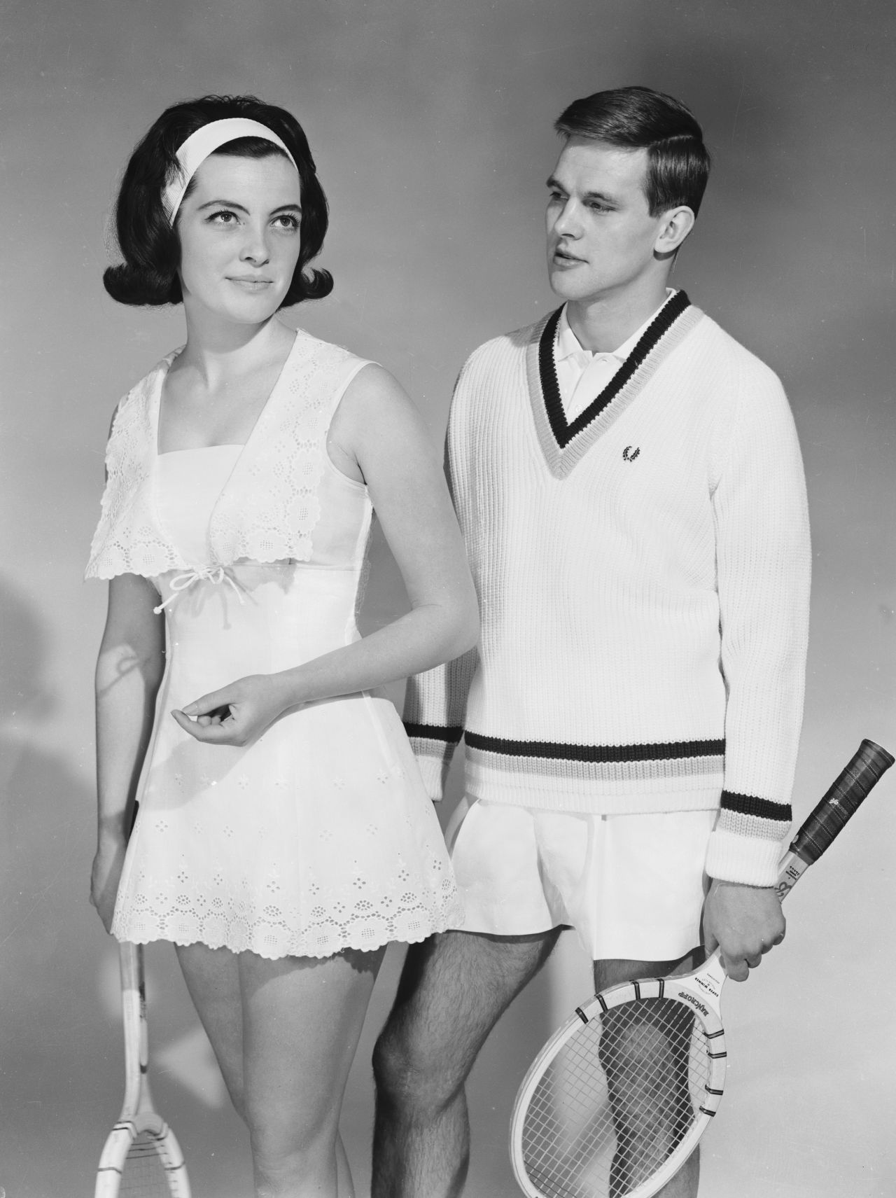 "You still see wooden tennis rackets showing up in clothing catalogs a fair amount today. It's become an iconic symbol of leisure, relaxation, wealth and elegance," says Rothenberg.<br />"You see models holding them over their shoulder with a sweater tied around their neck, and it's become a timeless, preppy prop."<br />Here, two models show off their stylish sports attire in 1964.