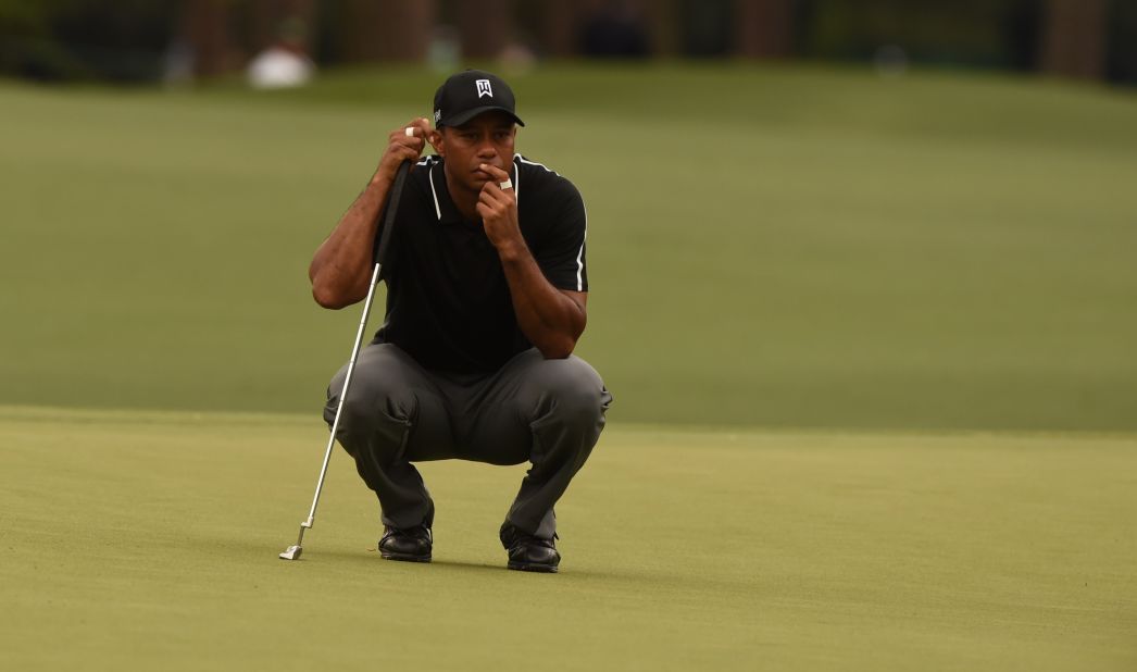 Tiger Woods lines a putt during Round 2 of the 79th Masters Golf Tournament on Friday. Woods' short game has been highly scrutinized during his comeback. 