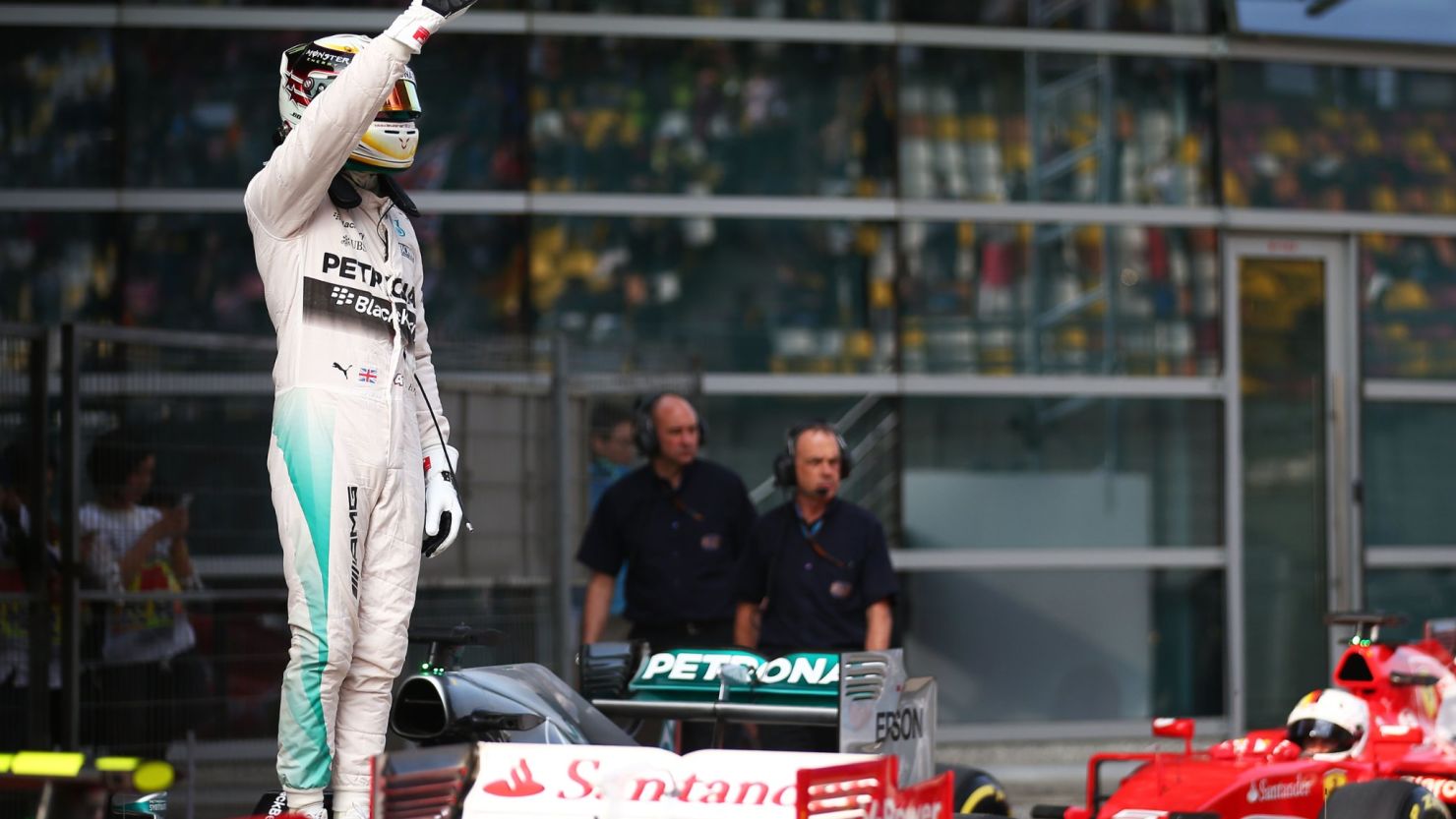 Lewis Hamilton celebrates after taking pole position in Shanghai in dramatic fashion.