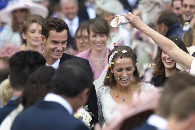 British tennis player Andy Murray and his new wife Kim Sears smile as they are showered in confetti after getting married at Dunblane Cathedral on April 11, 2015. 