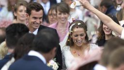 British tennis player Andy Murray and his new wife Kim Sears smile as they are showered in confetti after being married at Dunblane Cathedral on April 11, 2015. Tennis ace Andy Murray married his long-term girlfriend Kim Sears at Dunblane's 12th century cathedral today bringing his Scottish hometown to a standstill.