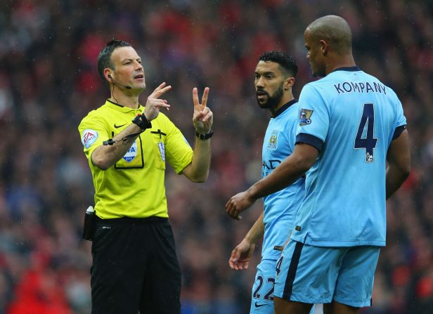 City captain Vincent Kompany (right) was lucky to escape with a yellow card for a late tackle on Daley Blind, but had to come off at halftime due to injury.