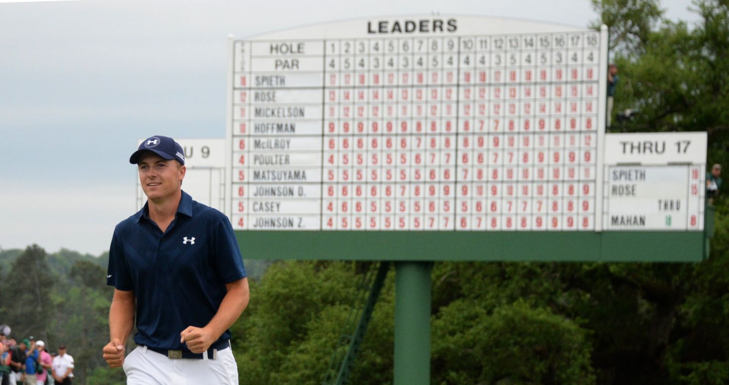 A bogey at the last hole meant Jordan Spieth matched Tiger Woods' record winning total of 18 under par, set in 1997.