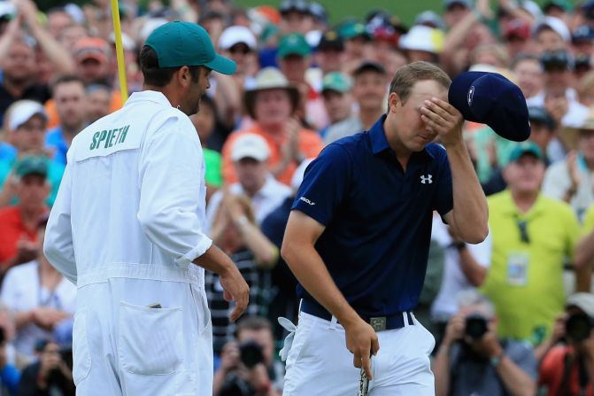 Masters champion Jordan Spieth savors the moment with his caddy Michael Greller after clinching his first major title by four strokes from Phil Mickelson and Justin Rose. <a href="index.php?page=&url=http%3A%2F%2Fwww.pga.com%2Fmasters%2Fscoring%2Fleaderboard" target="_blank" target="_blank">(See leaderboard)</a>