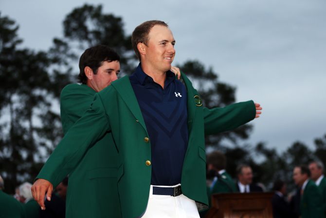 Defending champion Bubba Watson presents Jordan Spieth with the champion's green jacket after he <a href="index.php?page=&url=http%3A%2F%2Fwww.cnn.com%2F2015%2F04%2F12%2Fgolf%2Fmasters-jordan-spieth-golf%2Findex.html">won the 2015 Masters Tournament</a> on April 12 in Augusta, Georgia. 
