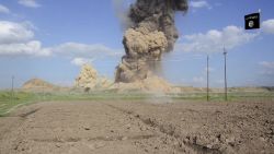 In this image made from video posted on a militant social media account affiliated with the Islamic State group late Saturday, April 11, 2015, purports to show militants destroying the ancient Iraqi Assyrian city of Nimrud, a site dating back to the 13th century B.C., near the militant-held city of Mosul, Iraq. The destruction at Nimrud, follows other attacks on antiquity carried out by the group now holding a third of Iraq and neighboring Syria in its self-declared caliphate. The attacks have horrified archaeologists and U.N. Secretary-General Ban Ki-moon, who last month called the destruction at Nimrud "a war crime."(militant video via AP)