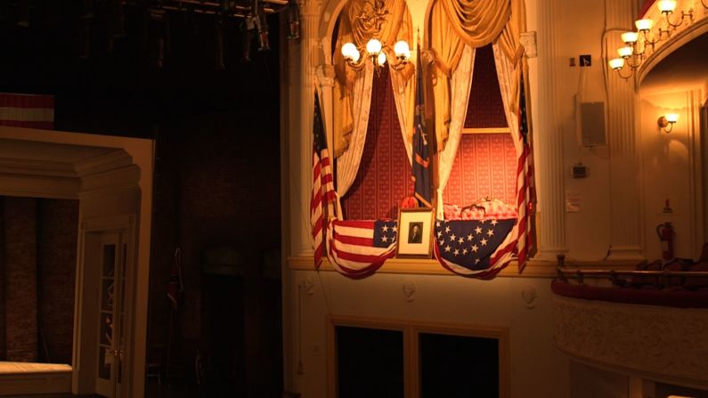 The State Box at Ford's Theatre is pictured in present day. The portrait of George Washington is the same one that hung on the box on the night of the assassination in 1865. There is a nick on the frame where John Wilkes Booth's spur struck it as he jumped from the box to the stage after he shot Lincoln.
