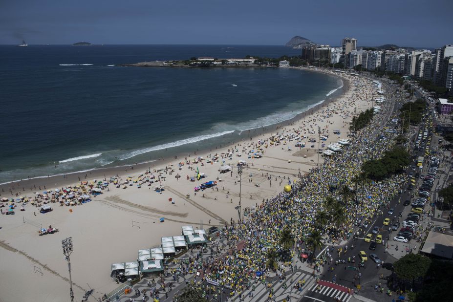 In Rio de Janeiro, Brazilians gathered and marched along Copacabana beach. 