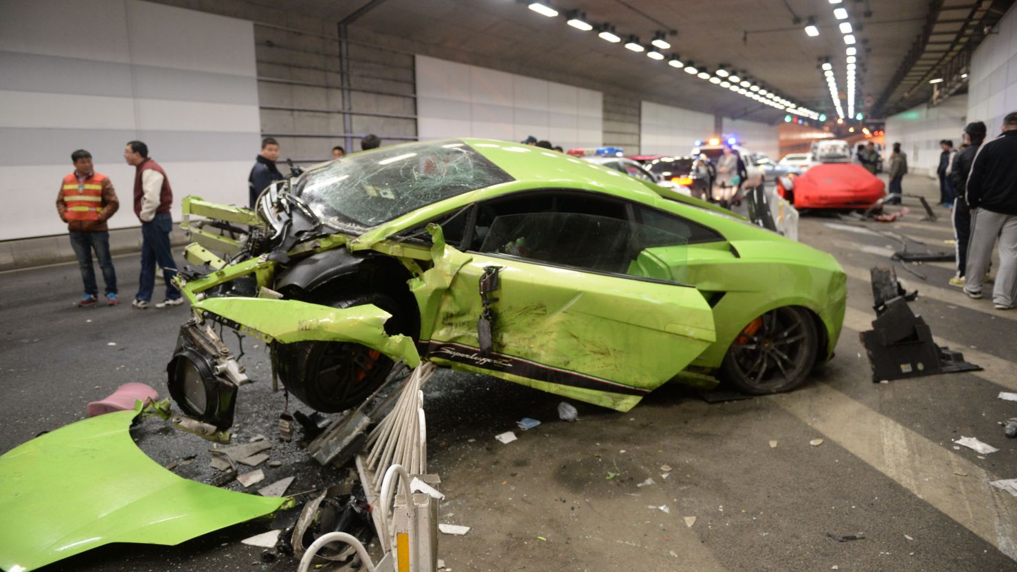 A wrecked Lamborghini lies in the center of a Beijing tunnel after a crash involving a Ferrari in a high-speed road race on April 11.