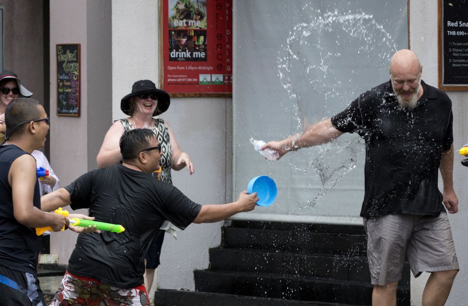 A tourist is showered in water by locals during the Songkran festival. The merrymaking doesn't only happen in Thailand. Countries across Southeast Asia, including Myanmar, Cambodia and Laos also celebrate the New Year water festival in mid-April.