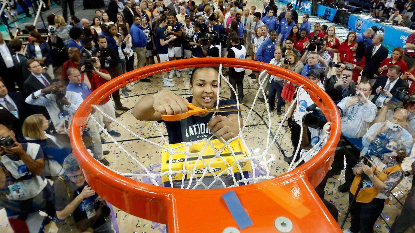 Connecticut's Kiah Stokes cuts a net in Tampa, Florida, after the Huskies defeated Notre Dame to win their third straight national title on Tuesday, April 7. UConn has now won 10 national championships since 1995, all under head coach Geno Auriemma.