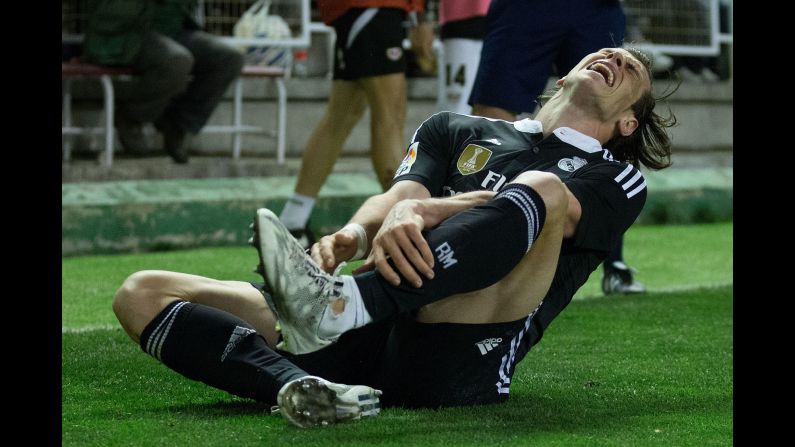 Real Madrid's Gareth Bale holds his leg after being tackled during a Spanish league match against Rayo Vallecano on Wednesday, April 8. Madrid won the home match 2-0.