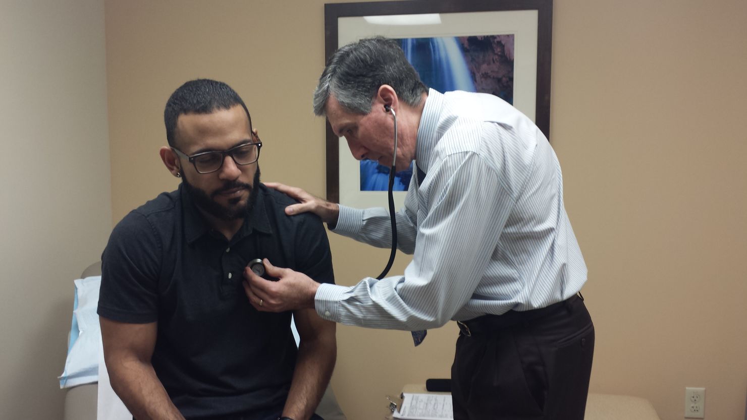 Dr. Mark Caruso examines patient Emanuel Vega during an annual physical exam at Baptist Health Primary Care in Miami.