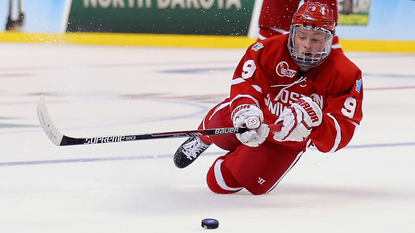 Jack Eichel of Boston University dives for the puck during the Frozen Four game against North Dakota on Thursday, April 9. Eichel, a freshman center, was this year's winner of the Hobey Baker Award, which is given to the nation's top collegiate player. He is widely expected to be one of the top picks in the next NHL draft.