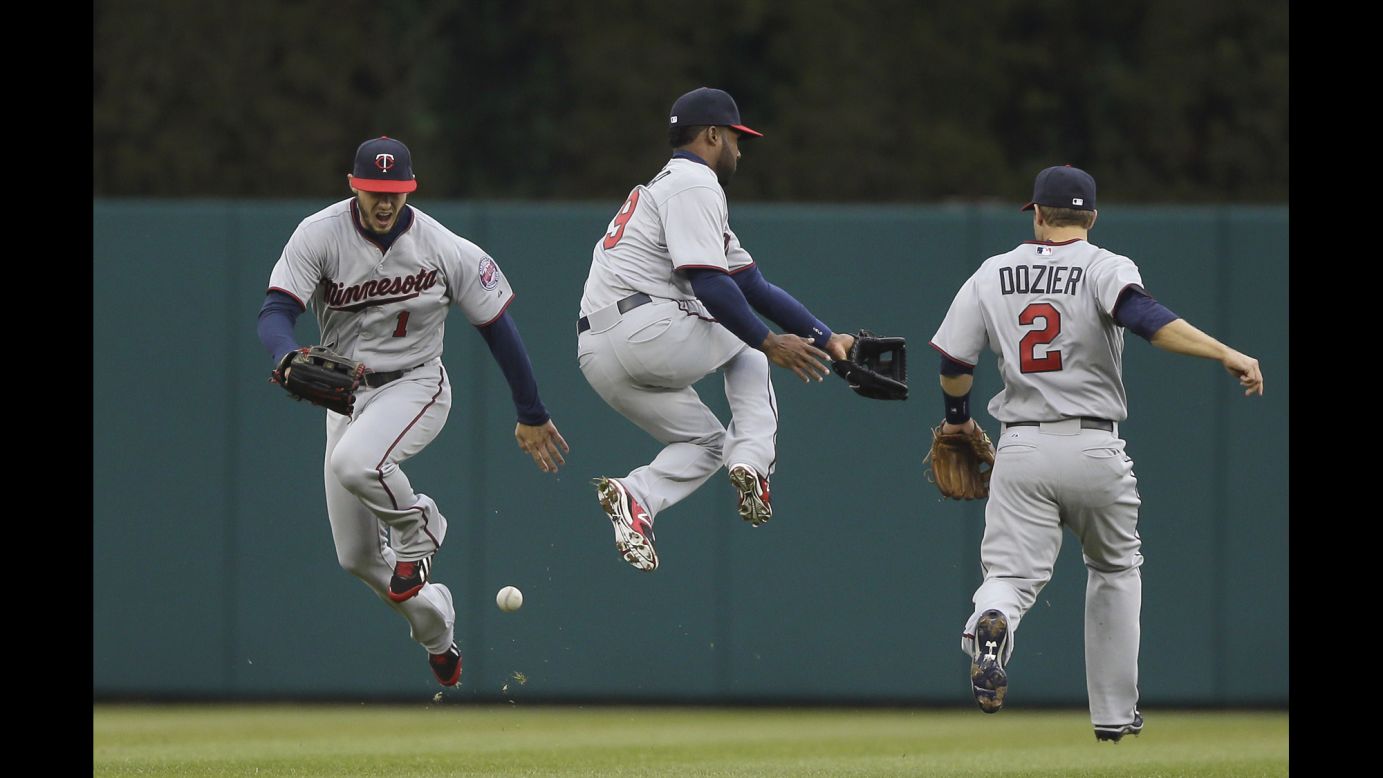From left, Minnesota Twins center fielder Jordan Schafer, shortstop Danny Santana and second baseman Brian Dozier chase after a blooper during a game in Detroit on Thursday, April 9.