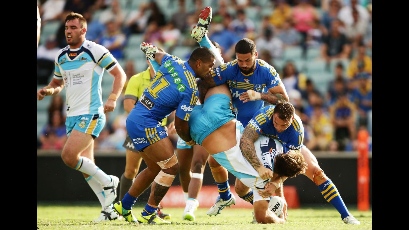The Parramatta Eels tackle David Taylor of the Gold Coast Titans during a National Rugby League match Saturday, April 11, in Sydney.