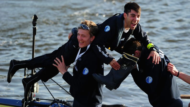 Oxford University's Will Hakim is lifted out of the boat following his crew's victory in the annual <a href="index.php?page=&url=http%3A%2F%2Fwww.cnn.com%2F2013%2F04%2F01%2Fsport%2Foxford-cambridge-boat-race%2F" target="_blank">Oxford-Cambridge Boat Race</a> on Saturday, April 11. The rowing race, held in London's River Thames, has been held almost every year since 1829.