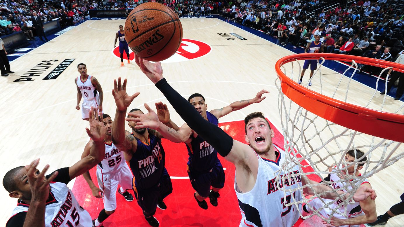 Mike Muscala of the Atlanta Hawks grabs a rebound during a home game against the Phoenix Suns on Tuesday, April 7.