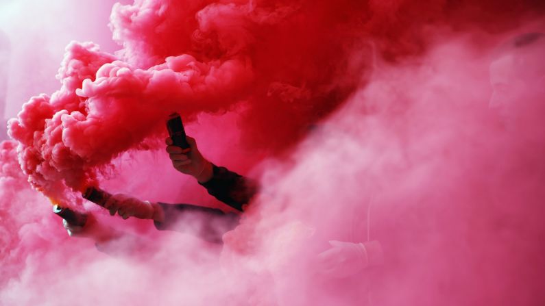 Fans of the German soccer club Stuttgart burn flares prior to the Bundesliga match against Werder Bremen on Sunday, April 12.