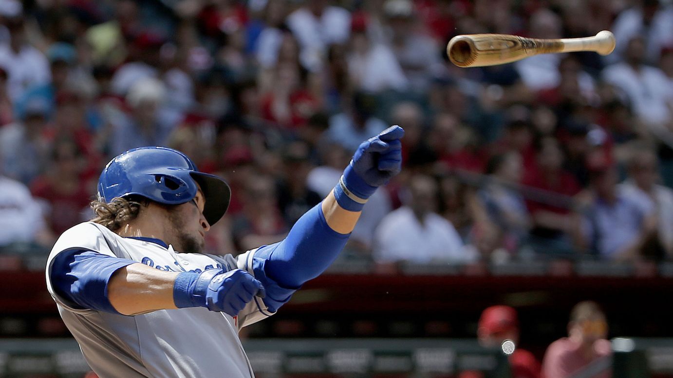 Yasmani Grandal of the Los Angeles Dodgers loses his bat as he makes a swing Sunday, April 12, in Phoenix.