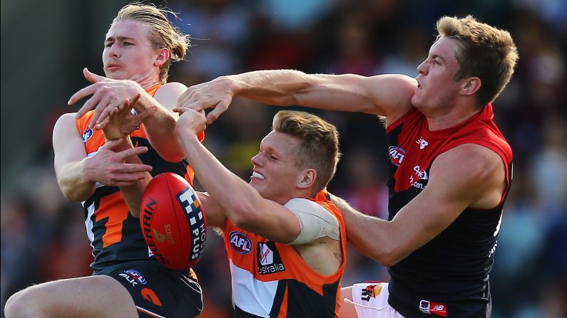 From left, Cam McCarthy, Adam Treloar and Tom McDonald compete for the ball Saturday, April 11, during an Australian Football League match between McDonald's Melbourne Demons and the Greater Western Sydney Giants. <a href="index.php?page=&url=http%3A%2F%2Fwww.cnn.com%2F2015%2F04%2F07%2Fsport%2Fgallery%2Fwhat-a-shot-sports-0407%2Findex.html" target="_blank">See 39 amazing sports photos from last week</a>