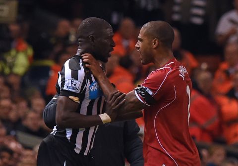 Liverpool defender Glen Johnson (right) clashes with Newcastle United's French midfielder Moussa Sissoko, who was sent off with seven minutes to play for a second yellow card after a bad tackle on Lucas Leiva.
