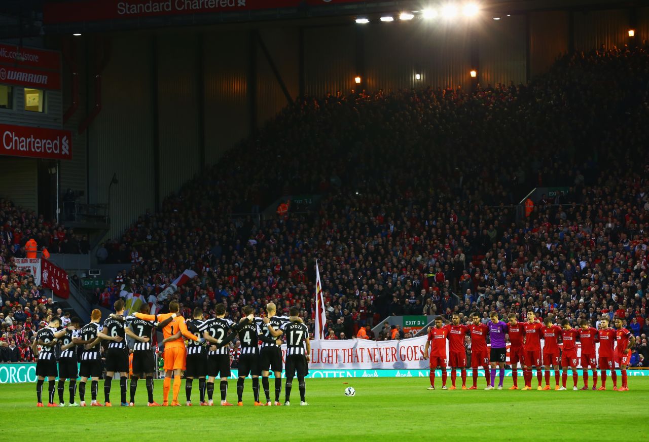 Fans, players and officials mark the Hillsborough anniversary before the Premier League match between Liverpool and Newcastle at Anfield in 2015.