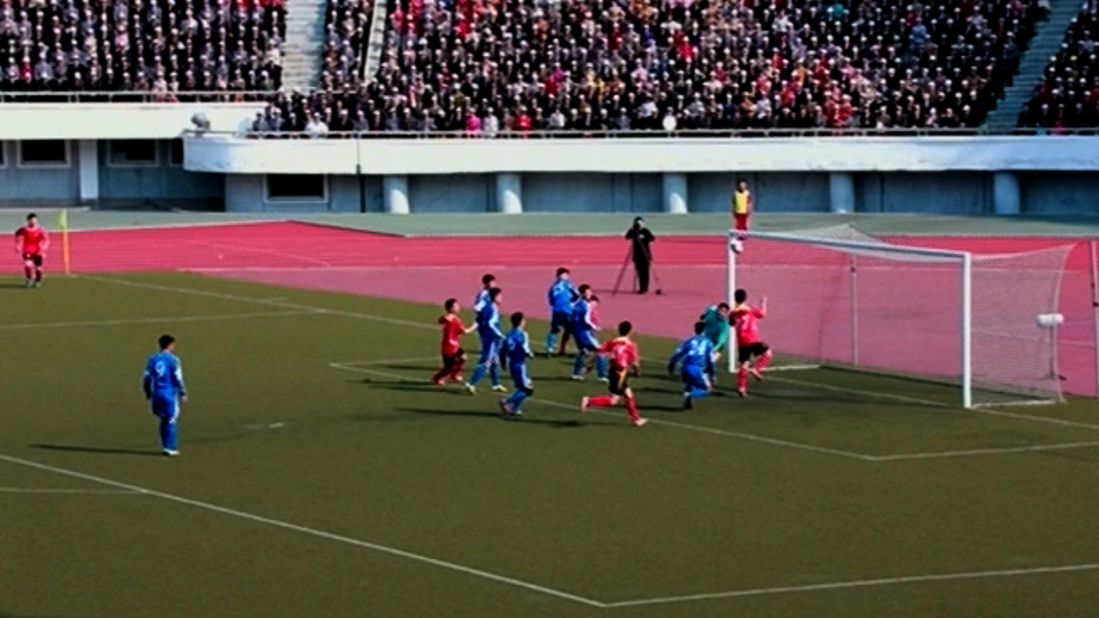 The match pitted Sonbong Team against Hwoebul Team, with Sonbong winning 3-1. According to KCNA, "players of both teams gave fullest play to their spiritual, physical and technical abilities, showing spectacular scenes." Spectators can be seen packing the stands.