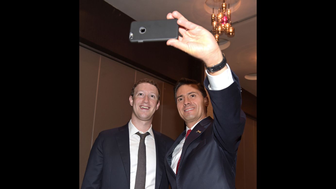 Mexican President Enrique Pena Nieto takes a selfie with Facebook CEO Mark Zuckerberg before their meeting Friday, April 10, at the Summit of the Americas in Panama City, Panama.
