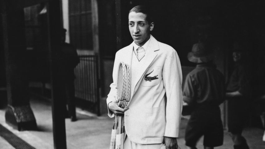 French Tennis player Rene Lacoste, one of France's 'Four Musketeers' who won the Davis Cup in 1932, at Wimbledon. He is wearing his embroidered crocodile motif. Original Publication: People Disc - HH0434 (Photo by Topical Press Agency/Getty Images)