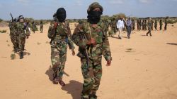 Somali Al-Shebab fighters gather on February 13, 2012 in Elasha Biyaha, in the Afgoei Corridor, after a demonstration to support the merger of Al-shebab and the Al-Qaeda network. Shebab insurgents staged rallies across Somalia on February 13 to celebrate their group's recognition by Osama bin Laden's successor as a member of the Islamist Al-Qaeda network. Al-Qaeda chief Ayman al-Zawahiri announced in a video message posted on jihadist forums on February 9, 2012 that Shebab fighters had joined ranks with the Islamist network. AFP PHOTO / Mohamed Abdiwahab (Photo credit should read Mohamed Abdiwahab/AFP/Getty Images)