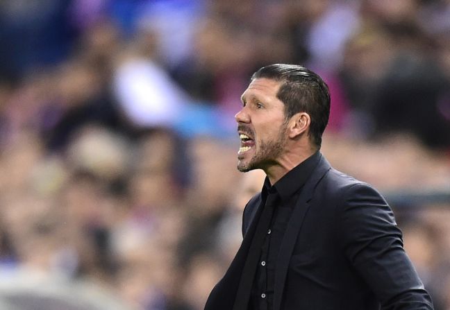 Atletico coach Diego Simeone desperately urges his team forward in the Champions League home tie against Real Madrid. 