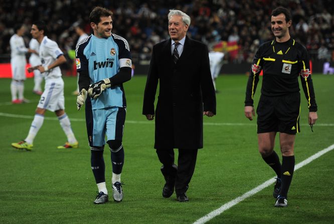 Peruvian Nobel Prize laureate Mario Vargas Llosa (C), who most recently wrote "The Discreet Hero" is another avid football fan. He's pictured walking with Iker Casillas (L) of Real Madrid prior to the start of a 2010 La Liga match in Madrid, Spain.