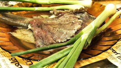 Raw Faseekh is served with onion and lemon.