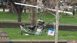 A gyrocopter sits on the West Lawn of the U.S. Capitol with members of the U.S. Capitol Police nearby April 15, 2015 in Washington, DC. Doug Hughes, 61, from Ruskin, FL., landed the gyrocopter on the West Lawn and was arrested immediately.