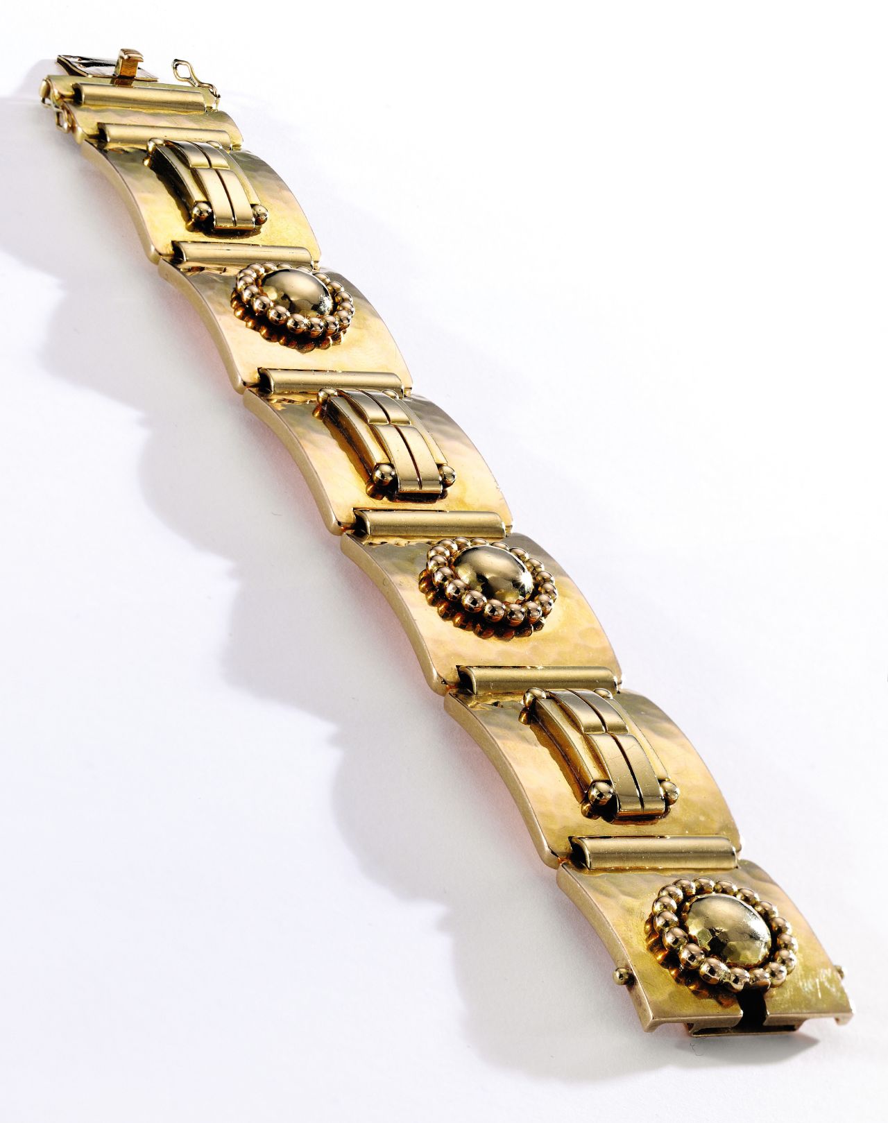 For those looking to avoid ostentatious jewels altogether, this Jean Després 18 karat gold bracelet from the 1930s is the perfect choice. The new owner paid $125,000.