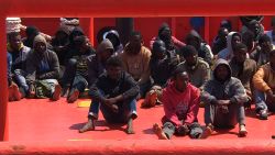 They were huddled in the back of a tugboat. Some were without shoes. Their coats and jackets, still wet, were in piled up in a huge container behind them. The 117 migrants, mostly from sub-Saharan African, arrived in the port of Augusta, Sicily, around one p.m. Tuesday, after being picked up by the tugboat off the coast of Libya. (April 14, 2015)