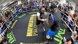 LAS VEGAS, NV - APRIL 14: WBC/WBA welterweight champion Floyd Mayweather Jr. (L) works out with co-trainer Nate Jones at the Mayweather Boxing Club on April 14, 2015 in Las Vegas, Nevada. Mayweather will face WBO welterweight champion Manny Pacquiao in a unification bout on May 2, 2015 in Las Vegas. (Photo by Ethan Miller/Getty Images)