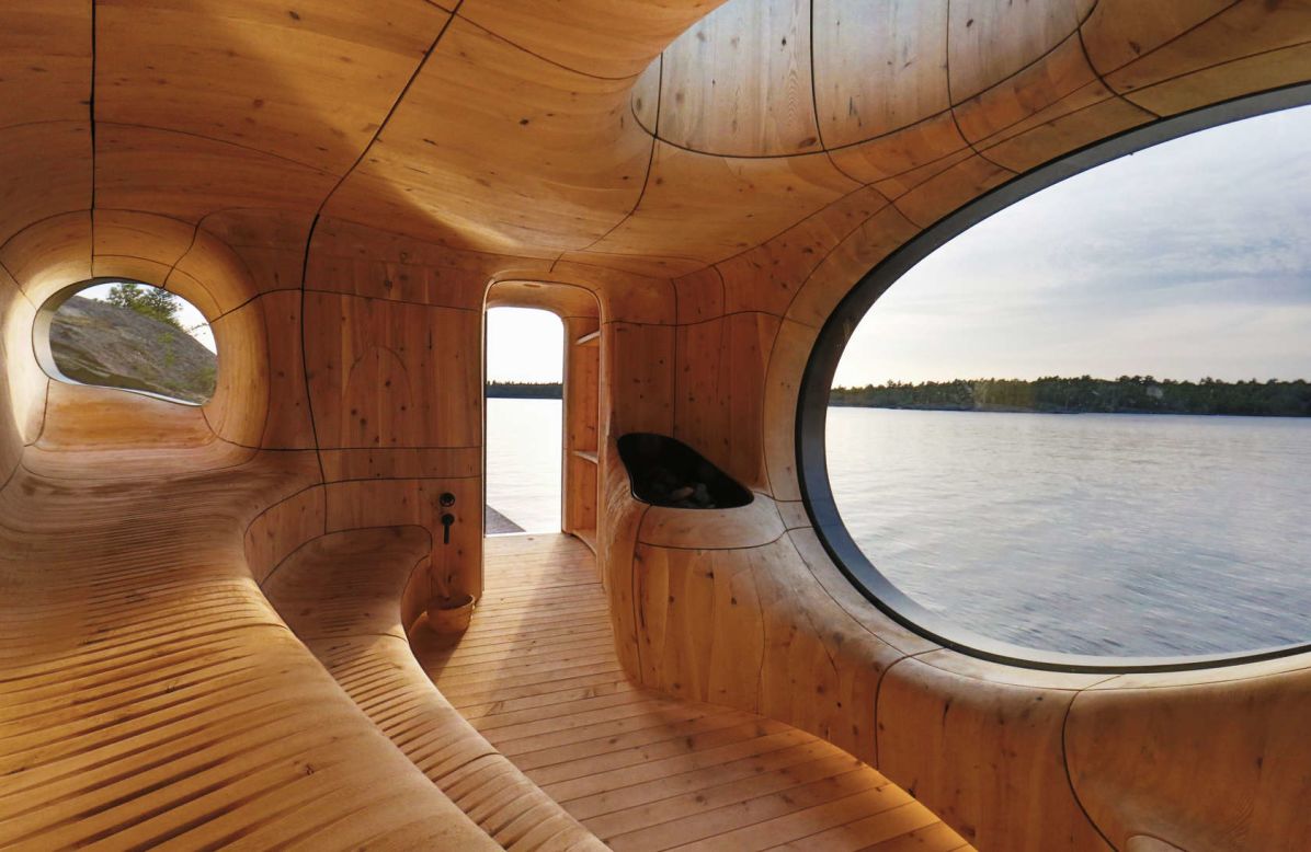Perched at the northwest edge of a private island in Ontario, the Grotto Sauna is a sculpted space designed by Partisans. "Challenging the standards of current practices in the construction industry, we worked directly with a millwork and steel fabrication partner on every detail," says the firm. "Together, we developed a new process of fabrication; utilizing state of the art 3-D technology to scan, model and build the Grotto."