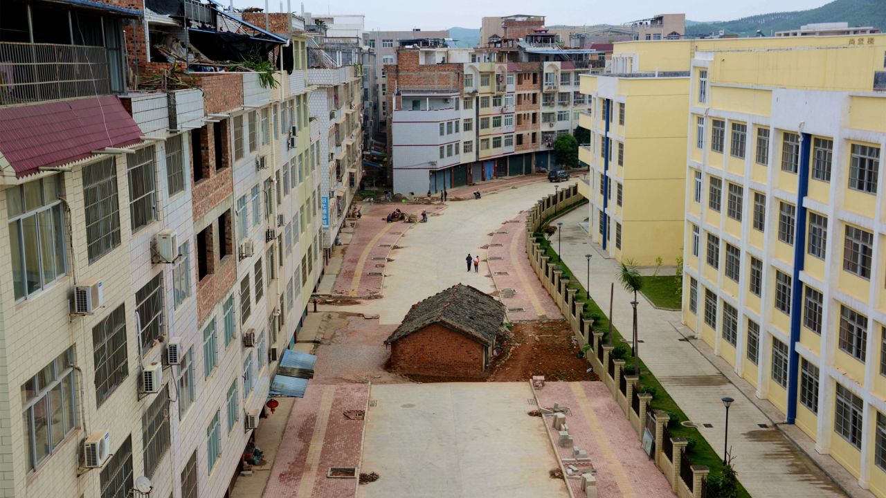 A house lies in the middle of a newly developed road in Nanning, Guangxi province on April 10, 2015. The owner was in a a dispute with the government over its demolition.  