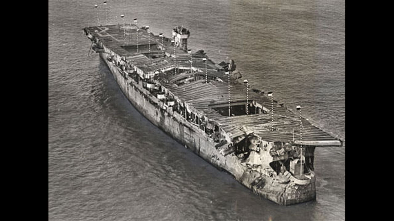 An aerial view of ex-USS Independence at anchor in San Francisco Bay, California, January 1951. There is visible damage from the atomic bomb tests at Bikini Atoll.