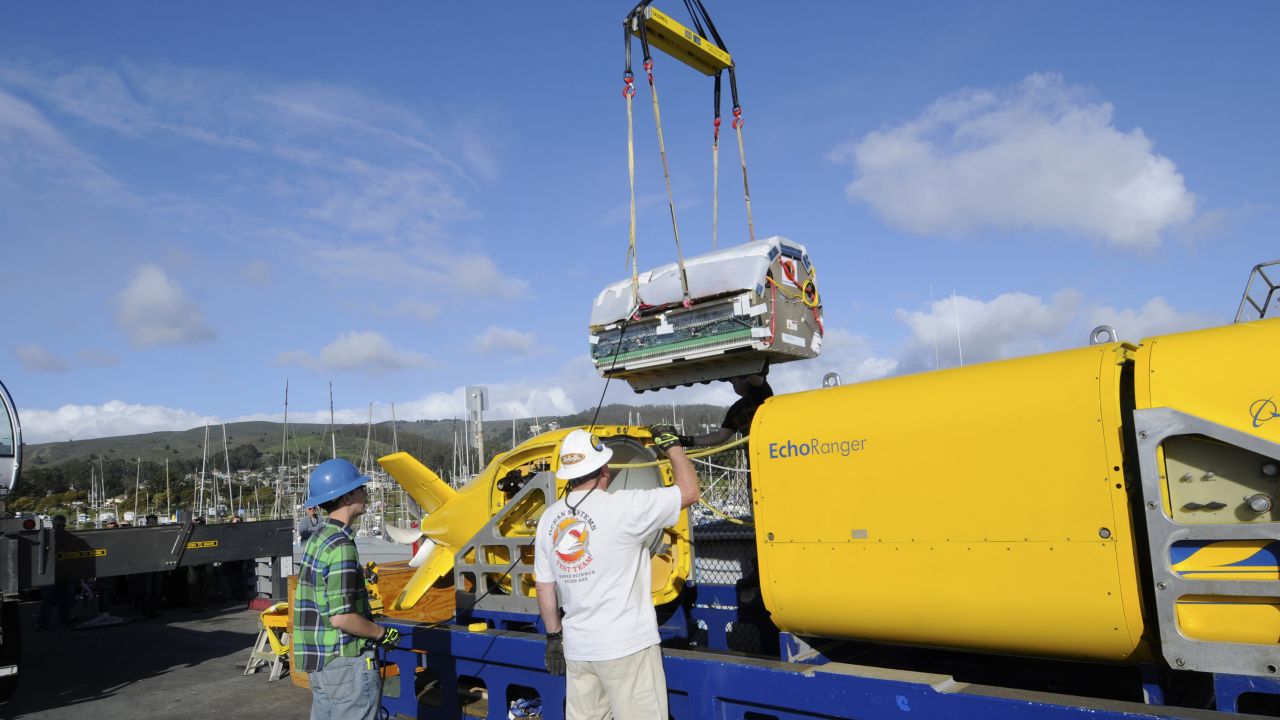 Project engineer Ross Peterson oversees the installation of the lithium polymer battery into Boeing's autonomous underwater vehicle Echo Ranger at Half Moon Bay, California. The battery is specifically designed for the AUV, providing the power needed for the 60-mile roundtrip mission.