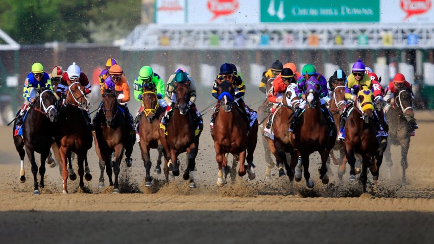The field comes out of the starter's gate to start the 140th running of the Kentucky Derby at Churchill Downs on May 3, 2014 in Louisville, Kentucky. 