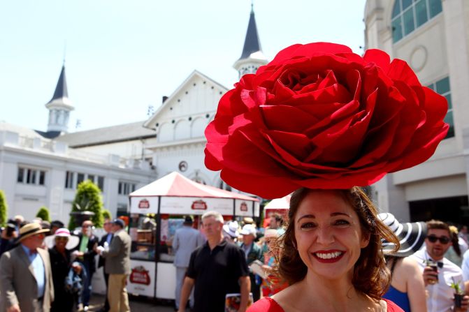 A race fan wearing a festive hat attends the 140th running of the Kentucky Derby at Churchill Downs on May 3, 2014 in Louisville, Kentucky.