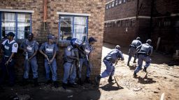Caption:South African anti-riot policemen raid a hostel in Benoni, outside Johannesburg, on April 16, 2015, whose local residents have been protesting against the presence of Foreign-owned shops in the area, forcing them to shut down and pelting with stones the trucks bringing them supplies. Tensions between locals and foreign nationals erupted in various parts of the country recently, as violence against immigrants in South Africa is common, with unemployed locals accusing foreigners of taking their jobs. AFP PHOTO / MARCO LONGARI (Photo credit should read MARCO LONGARI/AFP/Getty Images)
SUBSCRIPTION DOWNLOAD
SAVE TO LIGHTBOX
Date created:April 16, 2015Editorial #: 469919428 Restrictions:Contact your local office for all commercial or promotional uses. Full editorial rights UK, US, Ireland, Italy, Spain, Canada (not Quebec). Restricted editorial rights elsewhere, please call local office.Licence type:Rights-managed
Search results