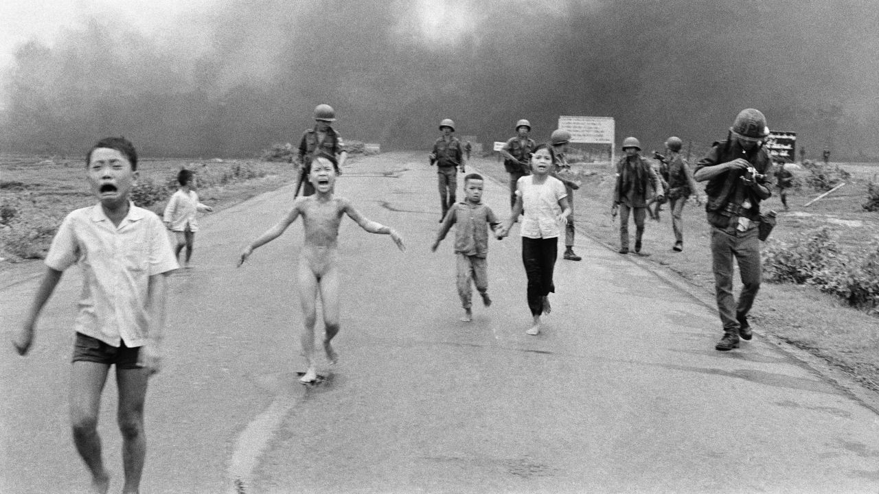 South Vietnamese forces follow after terrified children after a napalm attack on suspected Viet Cong hiding places in June 1972. A South Vietnamese plane accidentally dropped napalm on South Vietnamese troops and civilians. The terrified girl in the center had ripped off her burning clothes while fleeing.