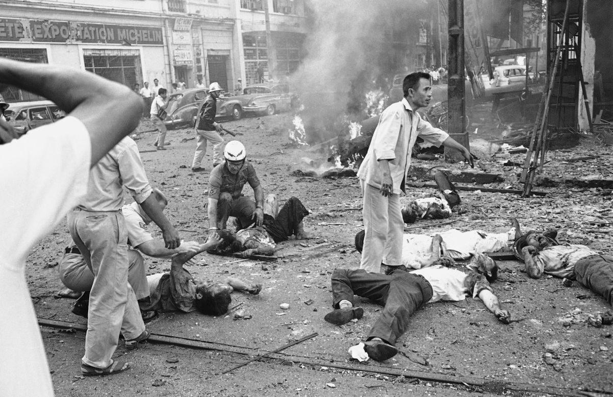 Injured people receive medical aid after an explosion at the U.S. Embassy in Saigon on March 30, 1965.