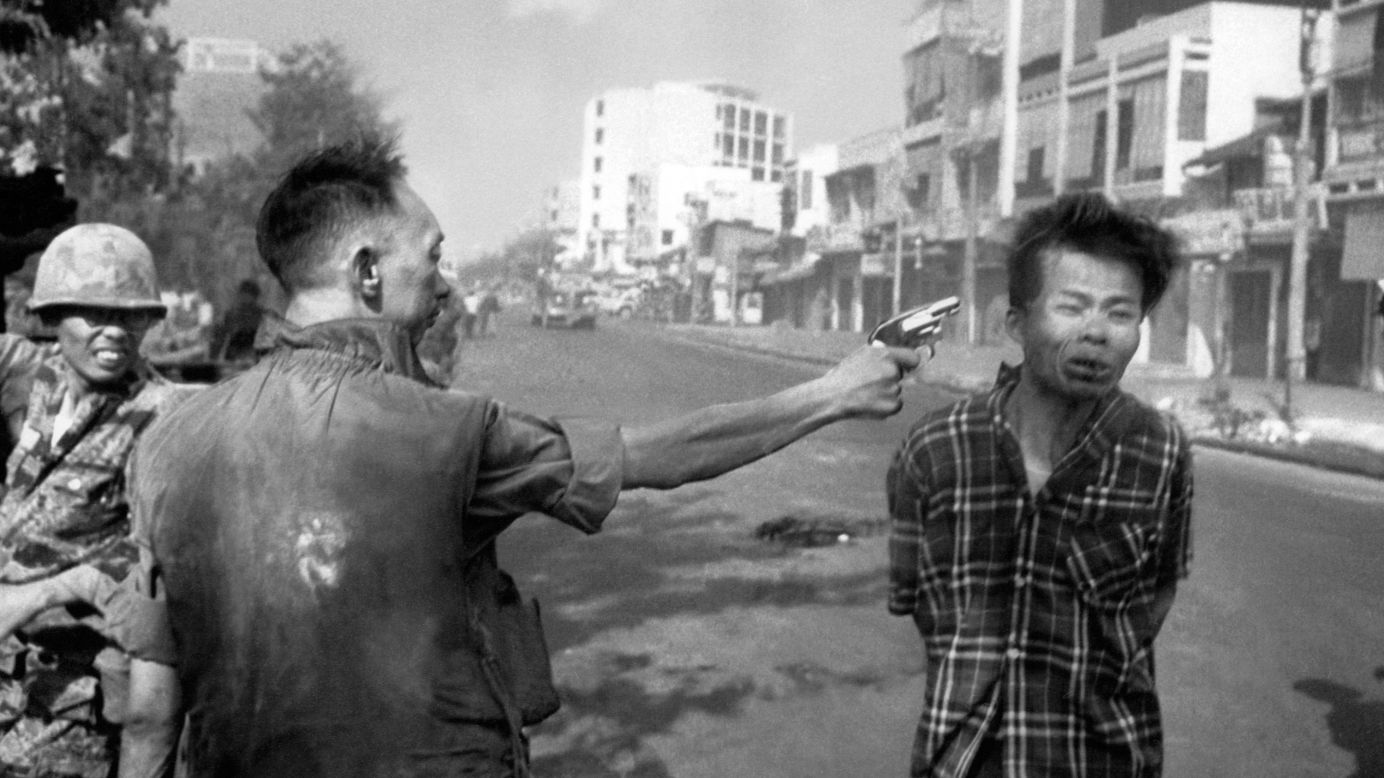 South Vietnamese Gen. Nguyen Ngoc Loan, chief of the National Police, fires his pistol into the head of suspected Viet Cong officer Nguyen Van Lem on a Saigon street on February 1, 1968, early in the Tet Offensive.